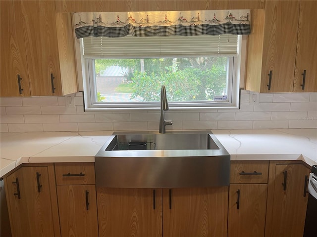3240 San Mateo St, Clearwater, FL 33759 - kitchen featuring tasteful backsplash, healthy amount of natural light, and brown cabinetry