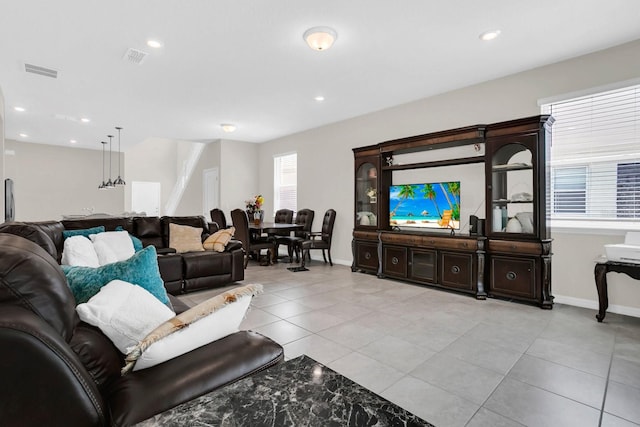 living room featuring light tile flooring