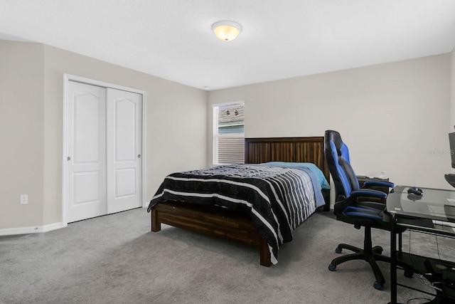 bedroom featuring carpet and a closet