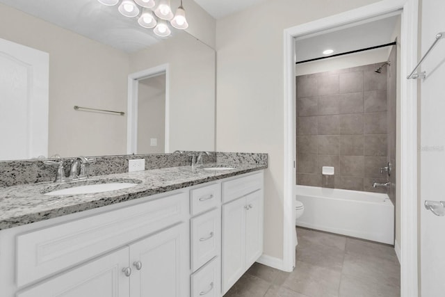 full bathroom featuring tiled shower / bath combo, dual vanity, toilet, and tile floors