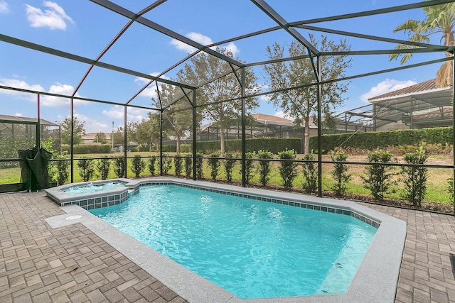 view of swimming pool with a lanai, an in ground hot tub, and a patio