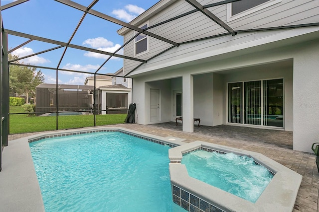 view of swimming pool featuring a patio area, glass enclosure, an in ground hot tub, and a yard