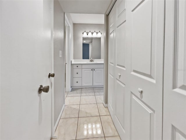 bathroom featuring tile patterned flooring and vanity