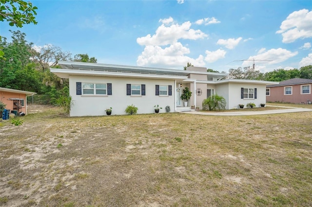 ranch-style home featuring a front yard