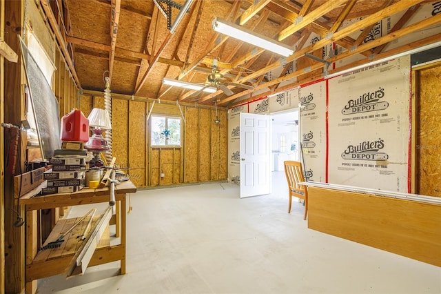 misc room featuring ceiling fan and concrete floors