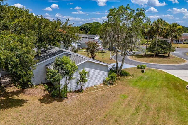 view of property exterior with a lawn