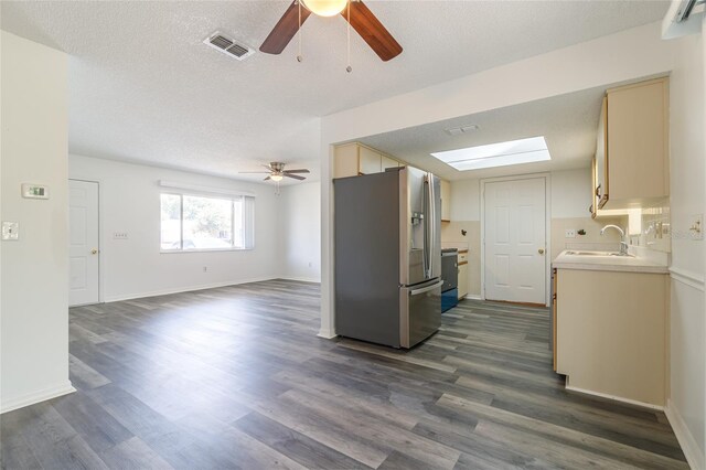 kitchen with ceiling fan, sink, stainless steel fridge with ice dispenser, dark hardwood / wood-style flooring, and decorative backsplash