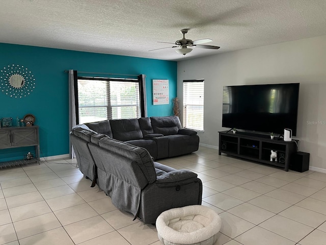 tiled living room featuring a textured ceiling and ceiling fan