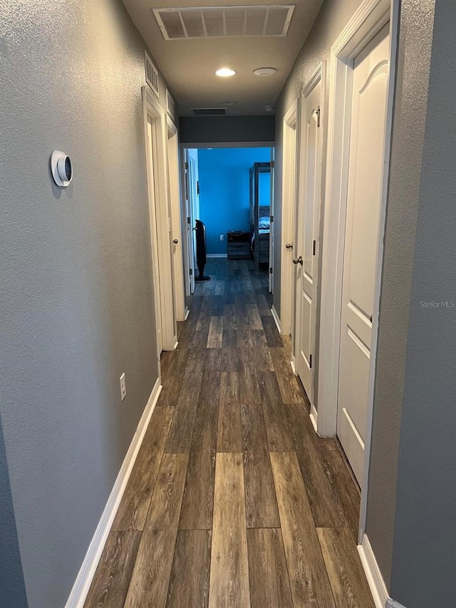 corridor with dark wood-type flooring