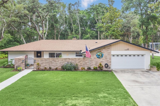 ranch-style house featuring a garage and a front yard