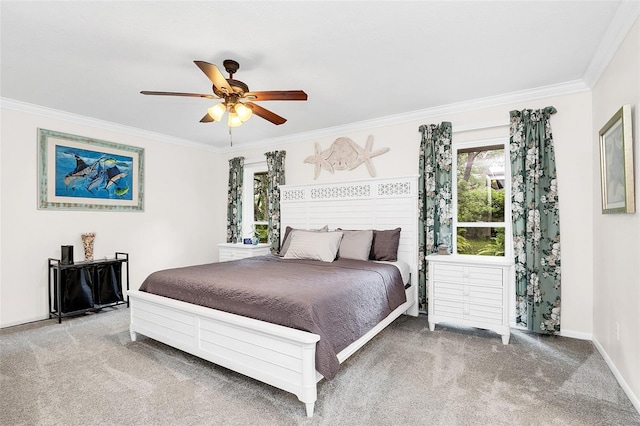 bedroom featuring ceiling fan, carpet floors, and ornamental molding