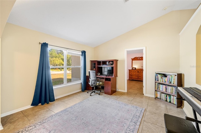 home office featuring light tile patterned floors and lofted ceiling