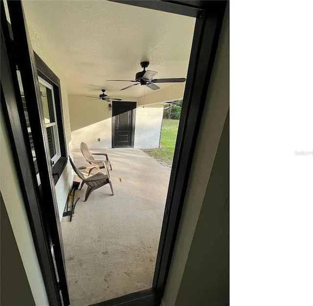 view of patio with ceiling fan