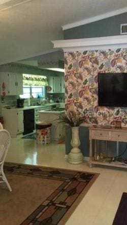 kitchen featuring dishwasher, lofted ceiling, and green cabinetry