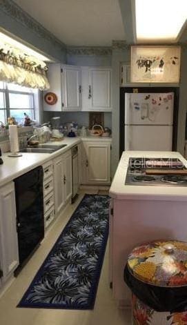 kitchen with dishwasher, white refrigerator, and sink