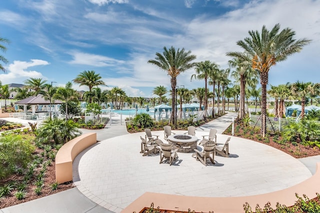 surrounding community featuring a gazebo and a fire pit