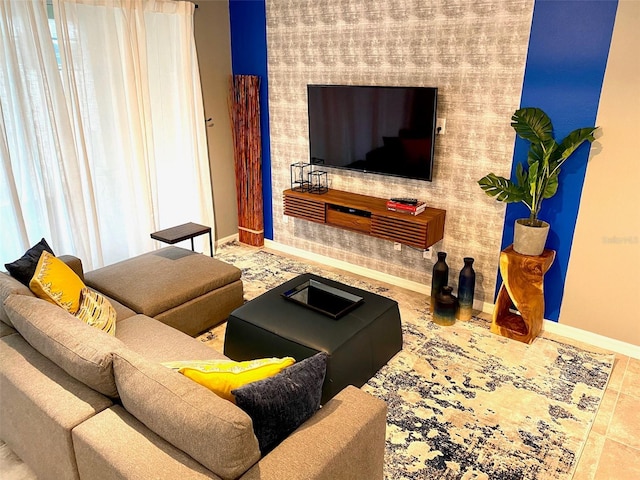 living room featuring tile patterned floors and plenty of natural light