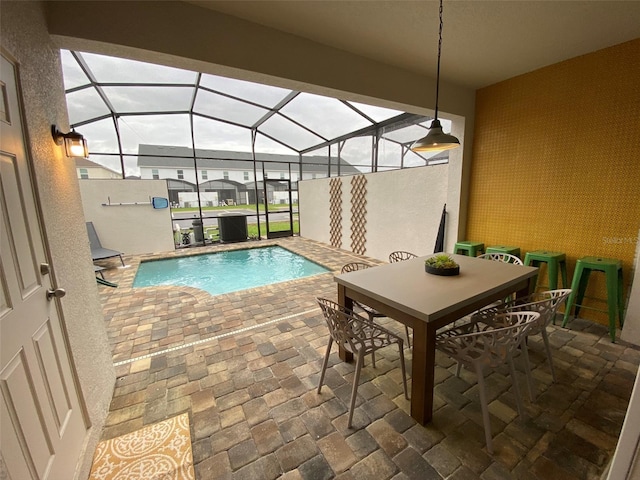 view of pool with a lanai and a patio