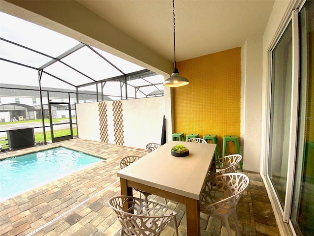 view of pool with a lanai and a patio