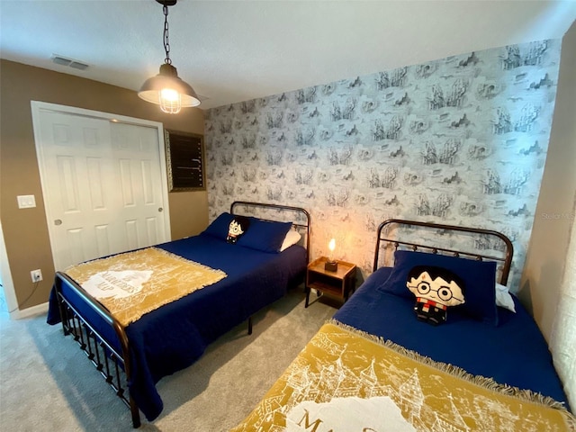 carpeted bedroom with a closet