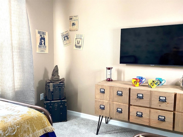 bedroom featuring light colored carpet