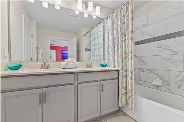 bathroom featuring vanity and shower / bath combo with shower curtain