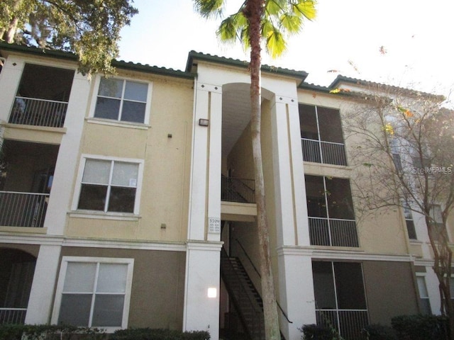 view of property featuring stairs