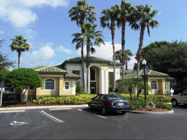 view of property featuring uncovered parking