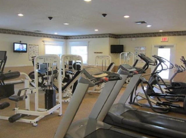 exercise room featuring recessed lighting