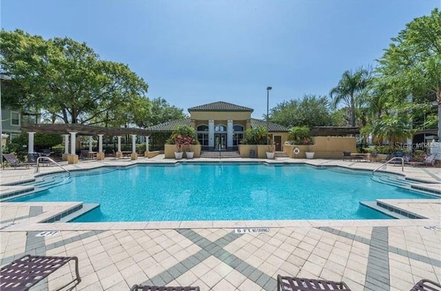 community pool featuring a patio area and a pergola