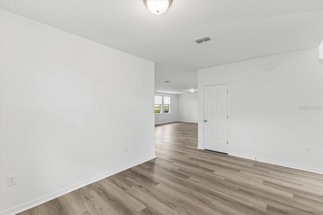 unfurnished room featuring light wood-type flooring