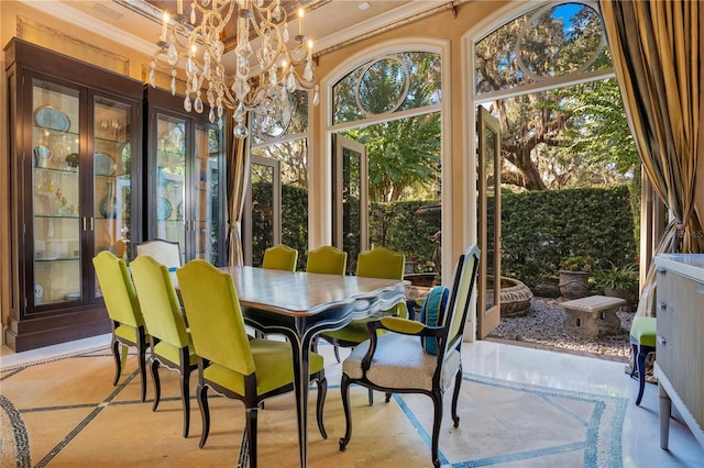 sunroom / solarium with an inviting chandelier