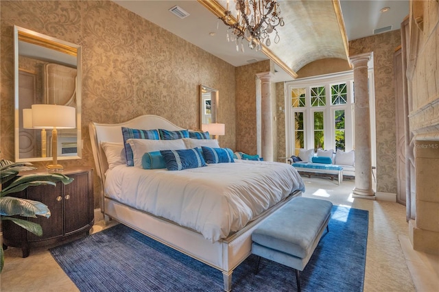 bedroom featuring decorative columns, vaulted ceiling, and an inviting chandelier