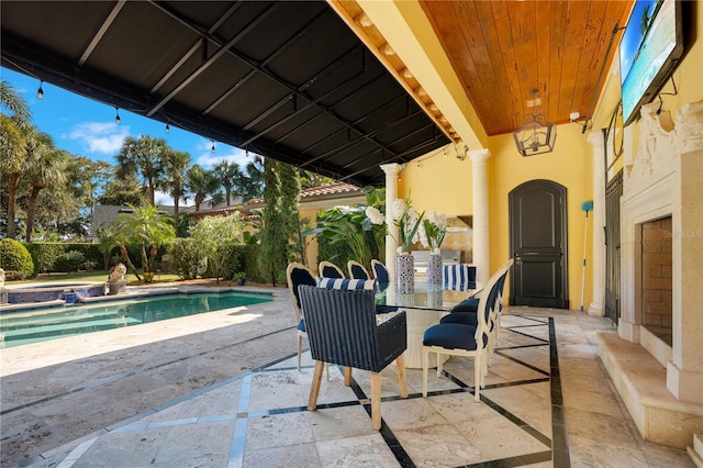 view of patio / terrace featuring a fenced in pool