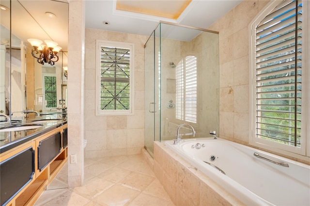 full bathroom with vanity, toilet, tile walls, and shower with separate bathtub