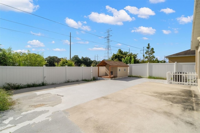 view of patio featuring a shed