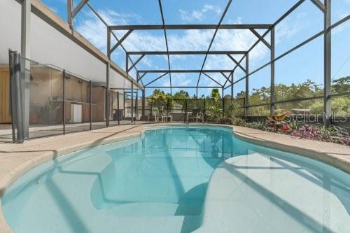 pool featuring glass enclosure