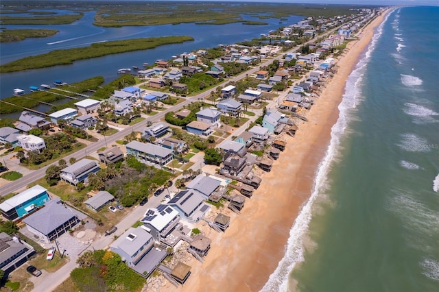 drone / aerial view with a view of the beach and a water view