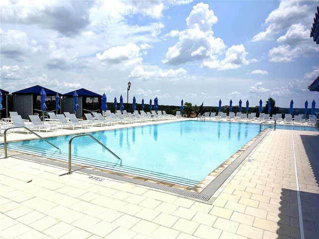 view of swimming pool featuring a patio area