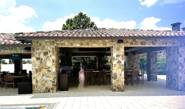 view of patio with an outdoor bar