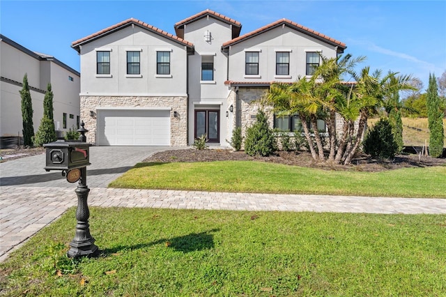 view of front of property with a garage and a front lawn