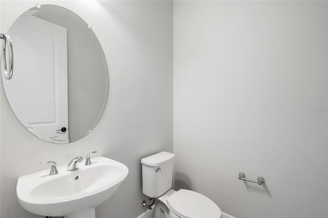 bathroom with sink and toilet