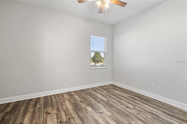 spare room with ceiling fan and hardwood / wood-style flooring