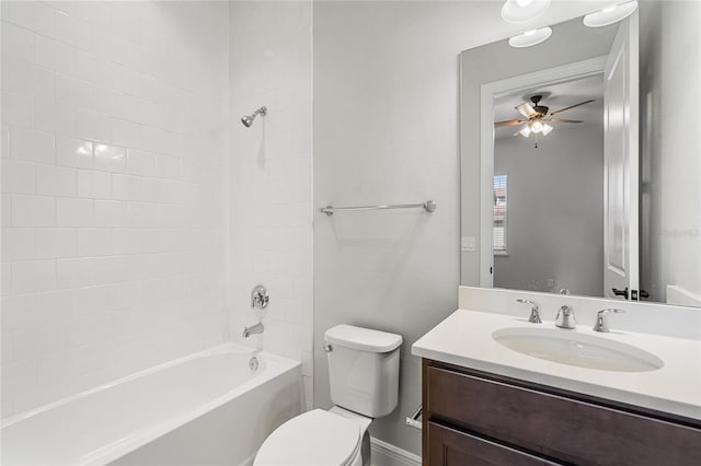 full bathroom featuring ceiling fan, vanity,  shower combination, and toilet