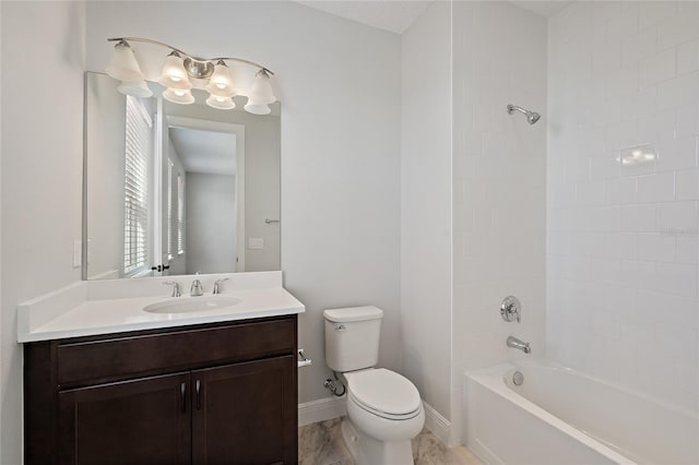 full bathroom with tiled shower / bath combo, toilet, and vanity