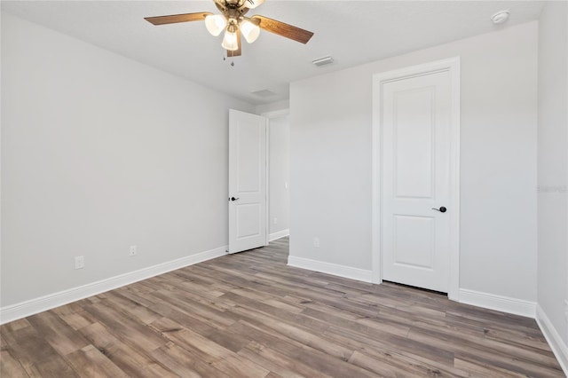 unfurnished bedroom with hardwood / wood-style floors and ceiling fan