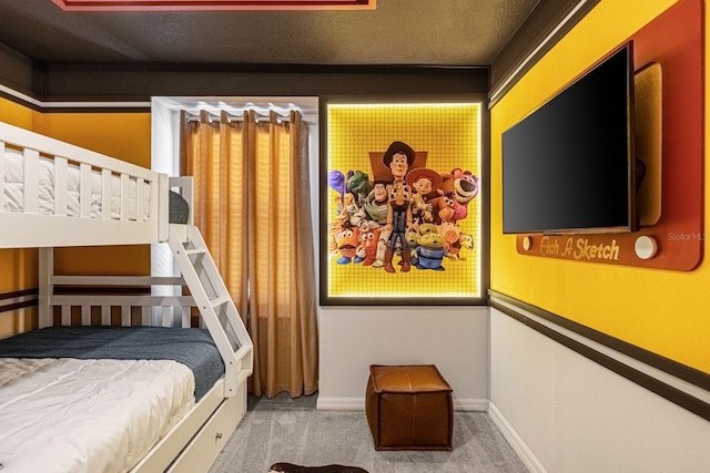 carpeted bedroom with a textured ceiling