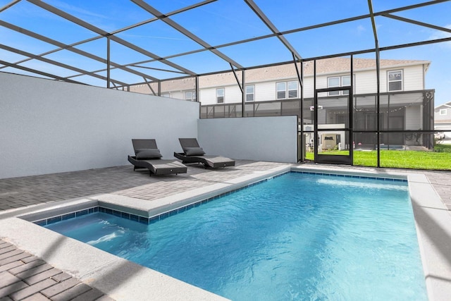 view of swimming pool featuring a patio area and glass enclosure