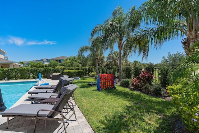 view of yard featuring a fenced in pool and a patio area