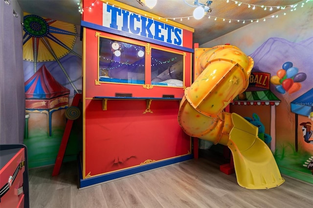 game room with wood-type flooring